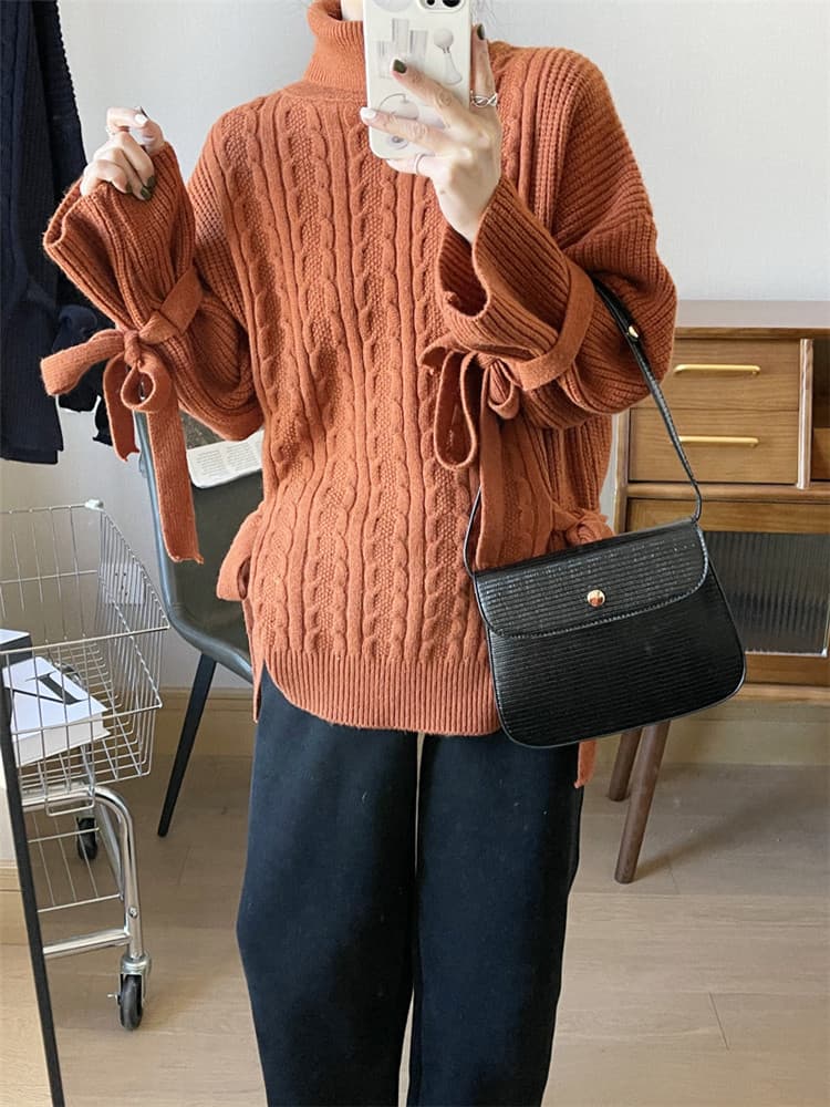 ネイビーコーデ 上品な花柄編み込み ゆったり長袖ニットトップス
