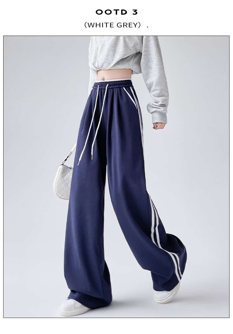ネイビーコーデ ゆったりストライプスポーティーパンツ